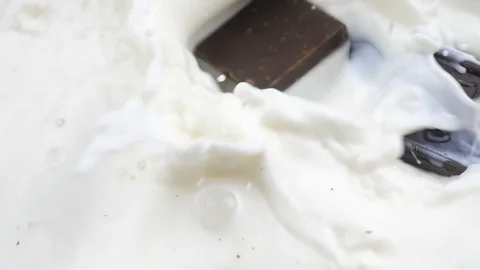 Chocolate Bars Falling in Milk Slow Motion Stock Footage 111867283