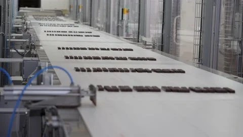 Chocolate bars move along a conveyor line  Stock Footage 146160404