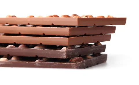 Chocolate bars with nuts close up on white isolated background with clipping  Stock Photos