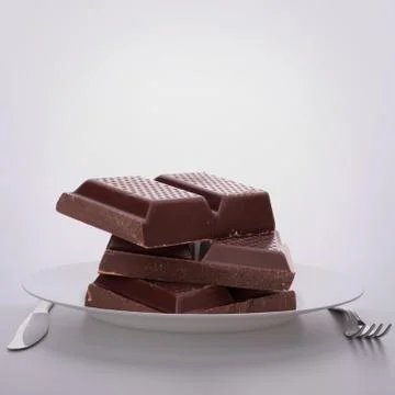 Chocolate bars stack on plate. 写真素材