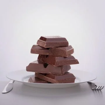 Chocolate bars stack on plate. Stockfoto's