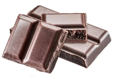 Chocolate bars stacked with smooth shiny surface and rich color Stock Photos