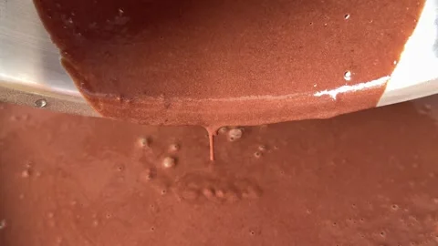 Chocolate Batter Dripping in Small Drops into Baking Pan Showing Thick Smooth Stock Footage 345173568