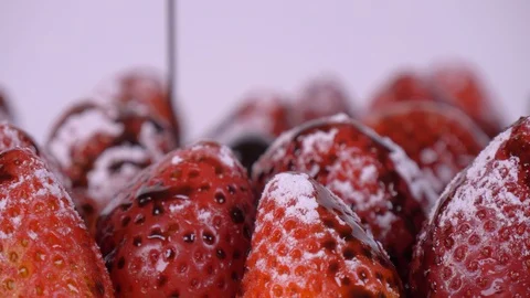 Chocolate being Drizzled on Strawberries while Rotating. Strawberries Stock-Footage 127990281