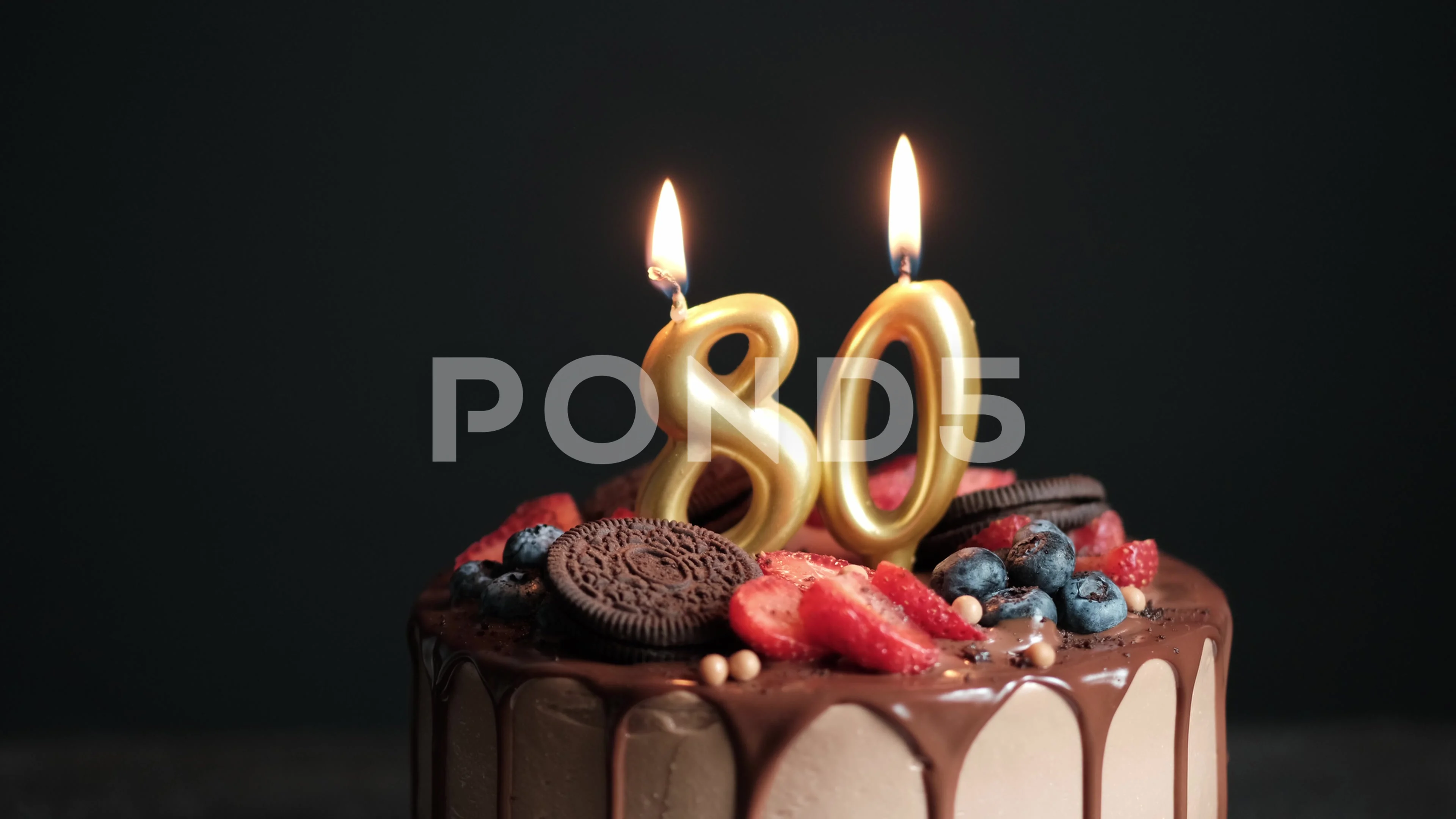 Chocolate birthday cake on black backgro... | Stock Video | Pond5
