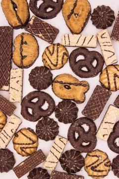 Chocolate biscuits and waffles on light background Stock Photos