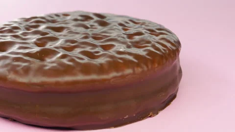 Chocolate biscuits panning on pink background.4k macro detail Stock Footage 155284017