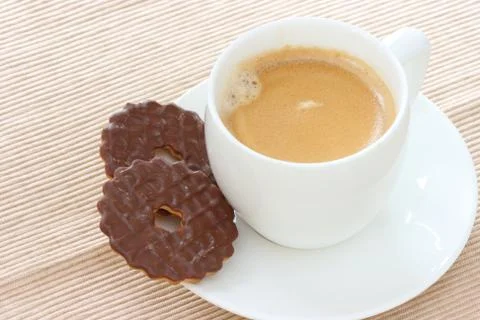 Chocolate biscuits on saucer with coffee Stock Photos