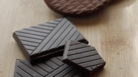 Chocolate biscuits stacked, close-up shot showing rich texture and dark Stock Footage 312029126