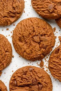Chocolate biscuits on a white surface, closeup from above Stock Photos