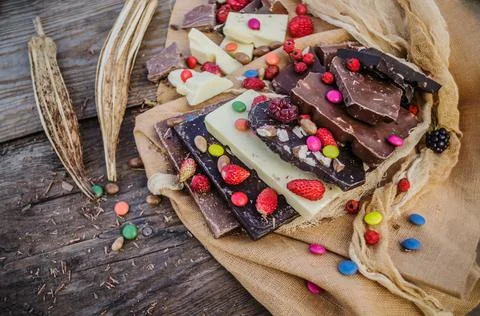 Chocolate blocks stack with different kind of chocolate. Stock Photos
