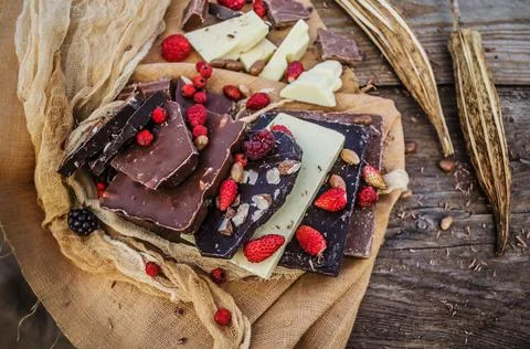 Chocolate blocks stack with different kind of chocolate. Stock Photos