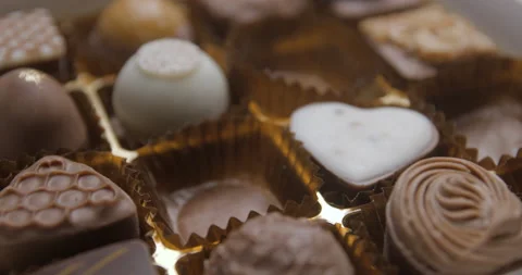 Chocolate box close up studio, bulimia, gluttony Stock Footage 242123775