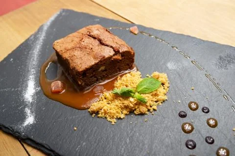 Chocolate brownie with cereals and mint. Stock Photos