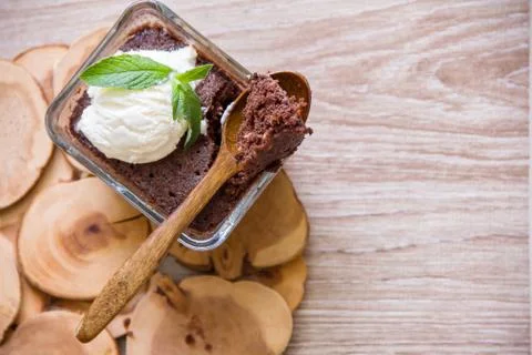 Chocolate brownie in a transparent rectangular baking dish, served with a min 스톡 사진