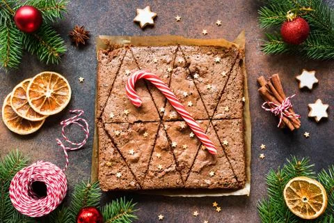 Chocolate brownies with candy cane and festive Christmas decorations. Stock Photos