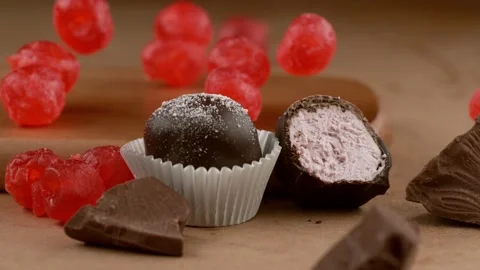 Chocolate cake and red candy grains from above. 4K footage Stock Footage 232317053