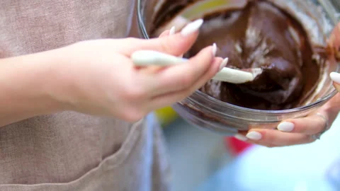 Chocolate cake batter Pour Batter Into A Baking Dish. Stock Footage 303728077