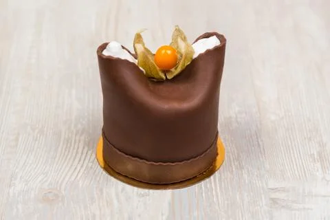 The chocolate cake with berry on the table Stock Photos
