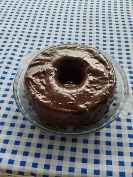 Chocolate cake on a checkered tablecloth Stock Photos