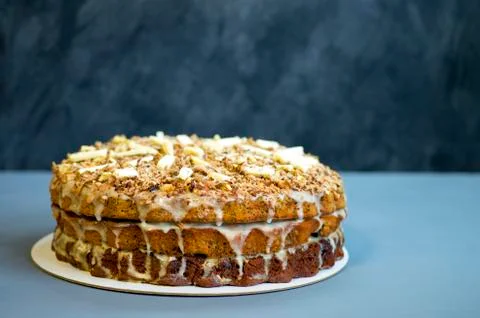 Chocolate cake close up on a gray table with a blue tint on a dark background Stock Photos