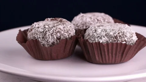 Chocolate cake in coconut flakes Stock Footage 123696599