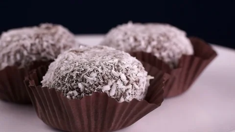Chocolate cake in coconut flakes Stock Footage 123696678