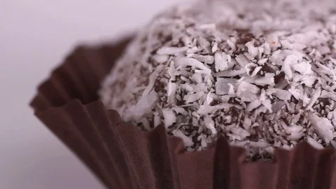 Chocolate cake in coconut flakes Stock Footage 123696803
