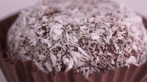 Chocolate cake in coconut flakes Stock Footage 123696829