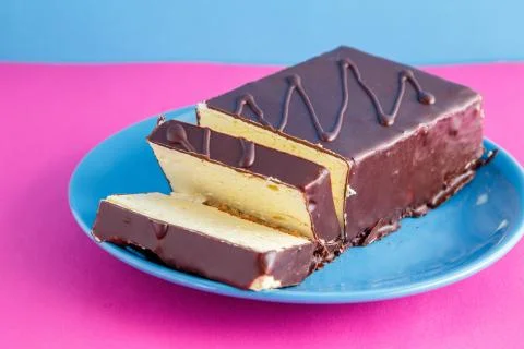 Chocolate cake on colored background Stock Photos