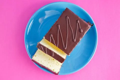 Chocolate cake on colored background Stock Photos