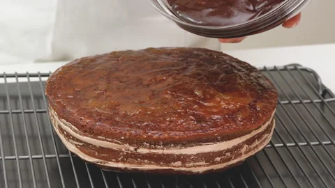 Chocolate Cake with cream and chocolate glaze recipe Stock Footage 162881172