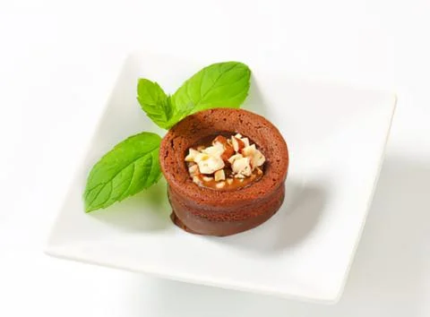 Chocolate cake cup with nuts and mint leaf Stock Photos