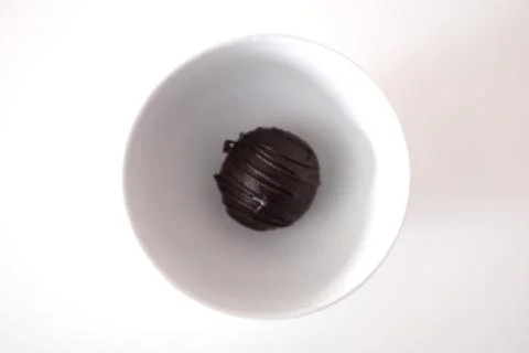 Chocolate cake in a cup on a white table Stock Photos