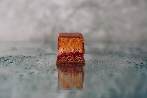 Chocolate cake cut on a mirror surface Stock-Fotos