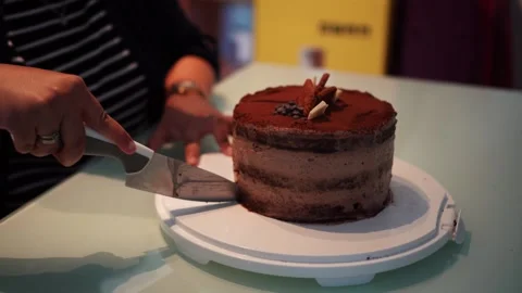Chocolate Cake Cutting With Knife on Cake Stand Static Shot Stock Footage 336950140