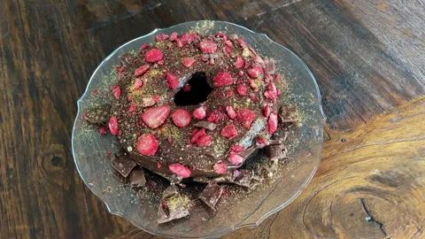 Chocolate cake decorated with freeze dried strawberries and gold dust Stock Footage 280365089