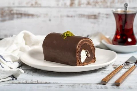 Chocolate cake. Delicious slice of cake on wooden background. patisserie prod Stock Photos