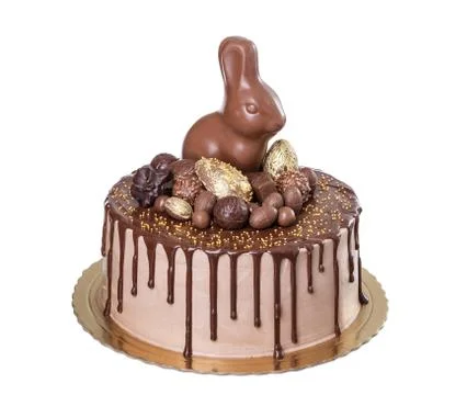 Chocolate cake for Easter with sweets and rabbit. Stock Photos