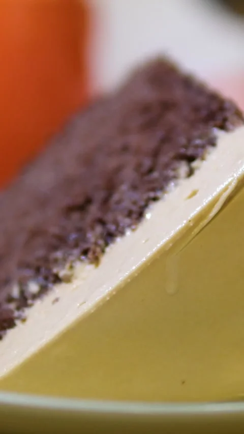 Chocolate cake eat with a fork Milk Cream Biscuit Cake. Delicious Biscuit Pastry Stock Footage 293972053