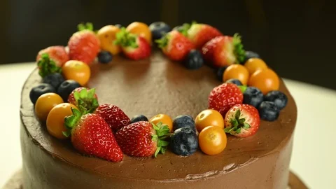 Chocolate cake with fruit spins Stock Footage 120401190