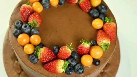 Chocolate cake with fruit spins Stock Footage 120402279