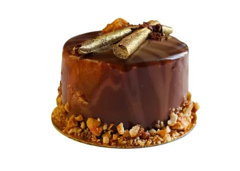 Chocolate cake isolate. Chocolate covered cake with golden sticks Stock Photos