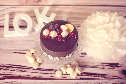 Chocolate cake with macaroons Stock Photos