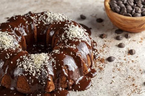 Chocolate cake with melted  pudding icing and chocolate chips in a bowl in th Stock Photos