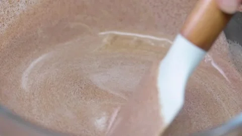 Chocolate Cake Mixture being Stirred Stock Footage 166863130
