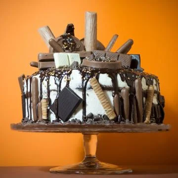 A chocolate cake on a orange background Stock Photos