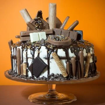 A chocolate cake on a orange background Stock Photos