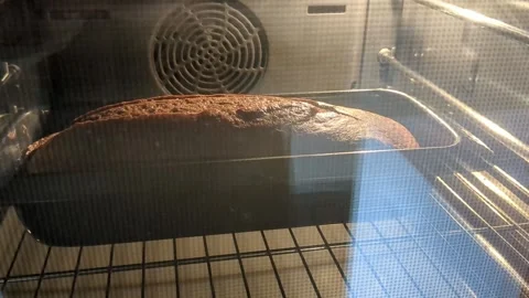 Chocolate cake in an oven Stock Footage 271062762