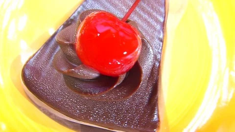 Chocolate cake square Spin on orange palette Stock Footage 74202520